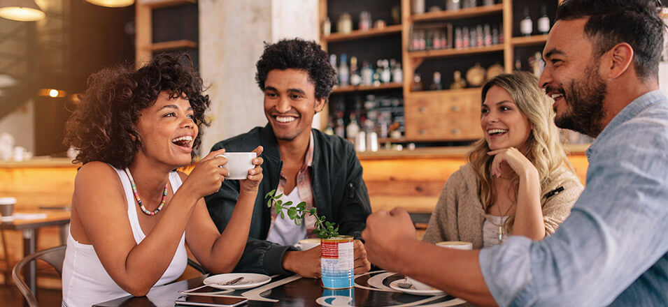 Young friends hanging out in a coffee shop