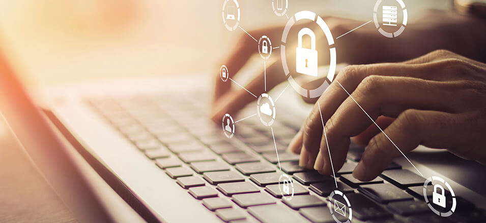 Hands typing on a computer with virtual locks