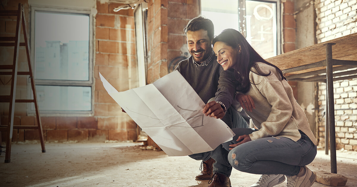 couple making renovation plans in their home