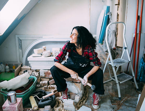 woman doing house renovation work
