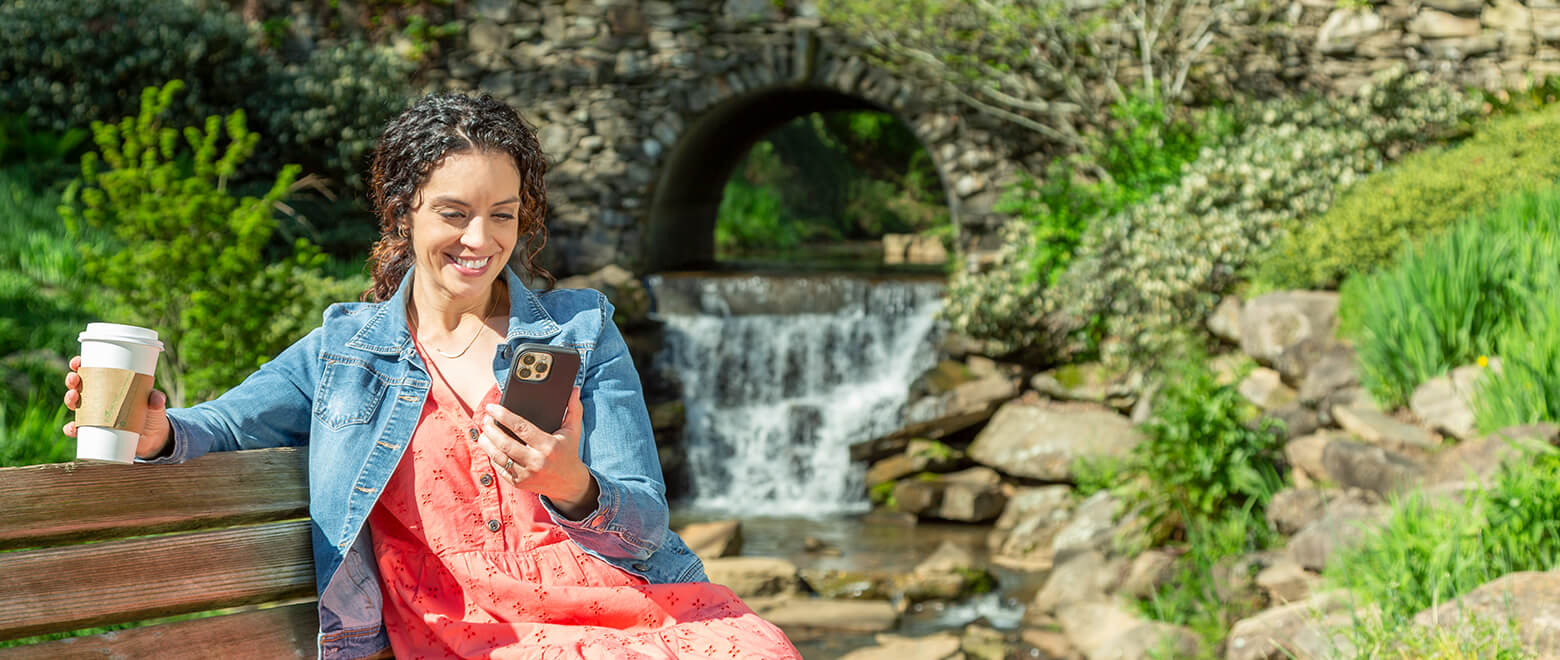 woman on mobile device doing digital banking